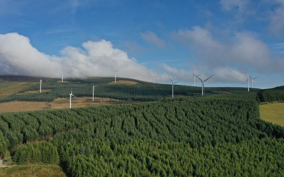 Wind turbines on a forested ridge, from the air